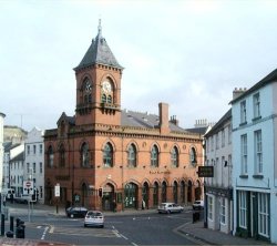 Arts Center Downpatrick. This Venetian Gothic red brick building replaced the old Market House in 1892. It was built at the sole expence of John Mulholland (the first Lord Dunleath). It was designed by William Butt of Belfast. The tall clock tower is a distinctive feature.
Photo - Pat Devlin

CLICK FOR LARGER PICTURE